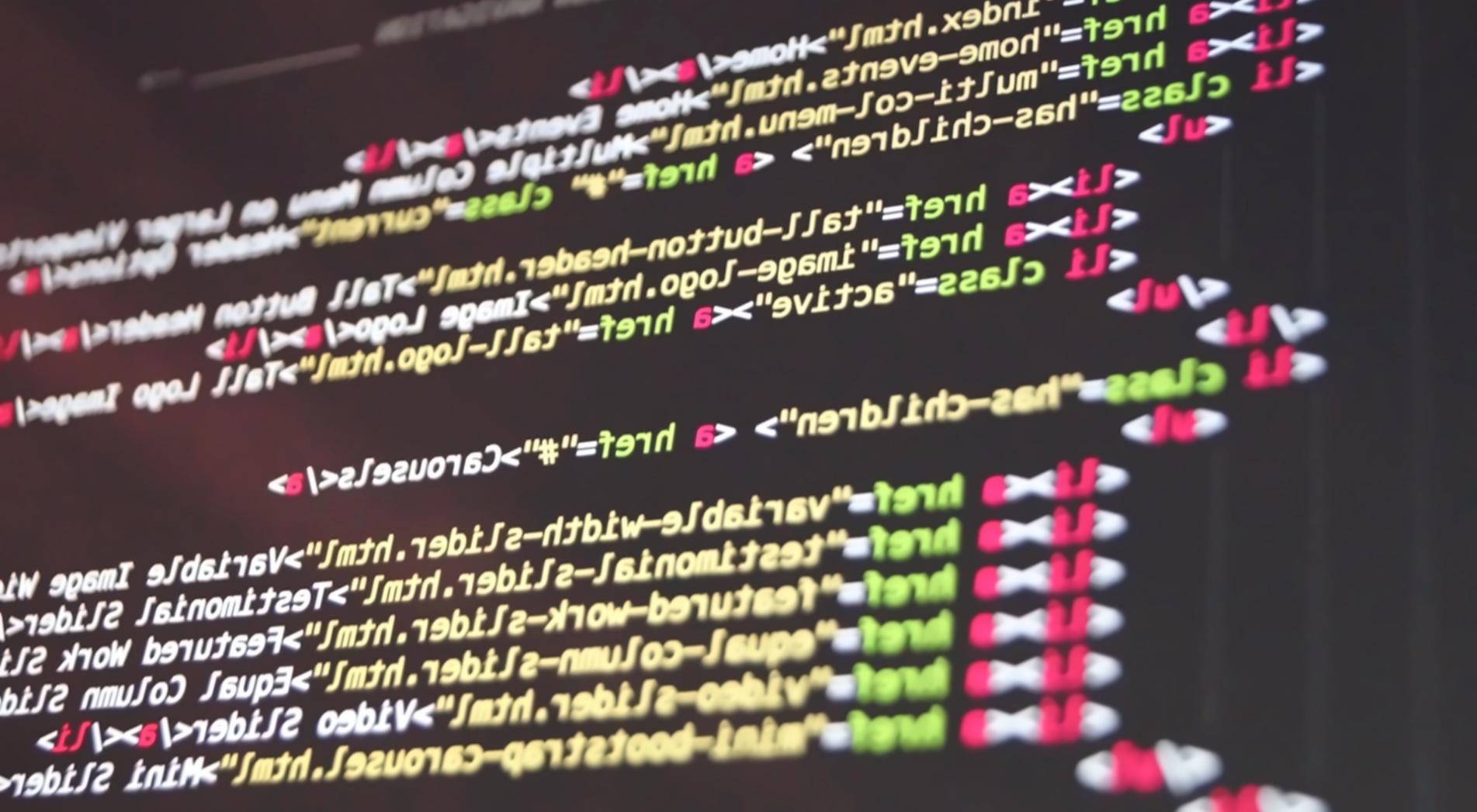 Game development workspace showing code editor, design tools and gaming interface